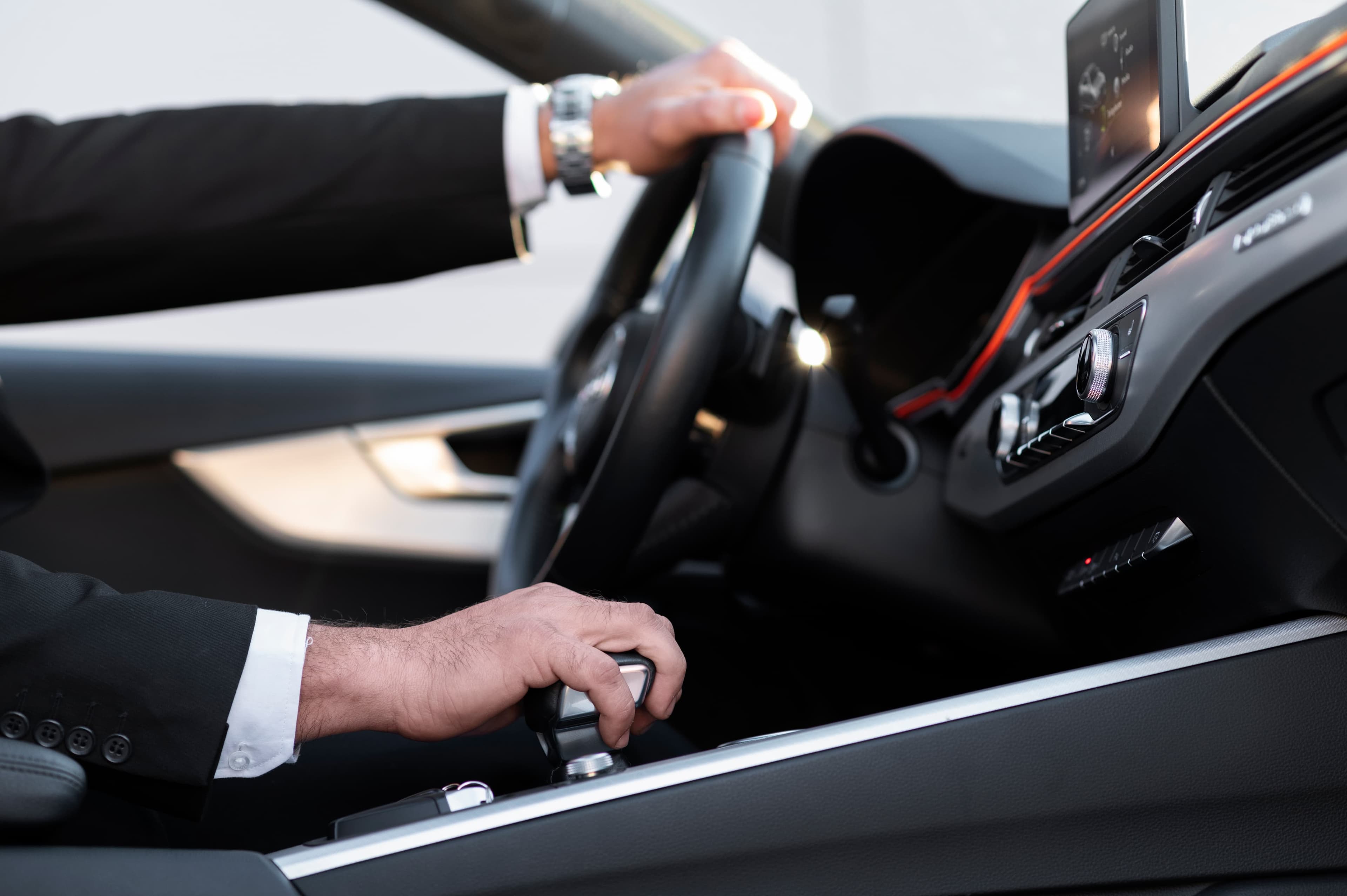 Chauffeur assisting a passenger arriving from an aircraft
